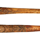 A decorated human bone dagger (top) and a decorated cassowary bone dagger (bottom)
